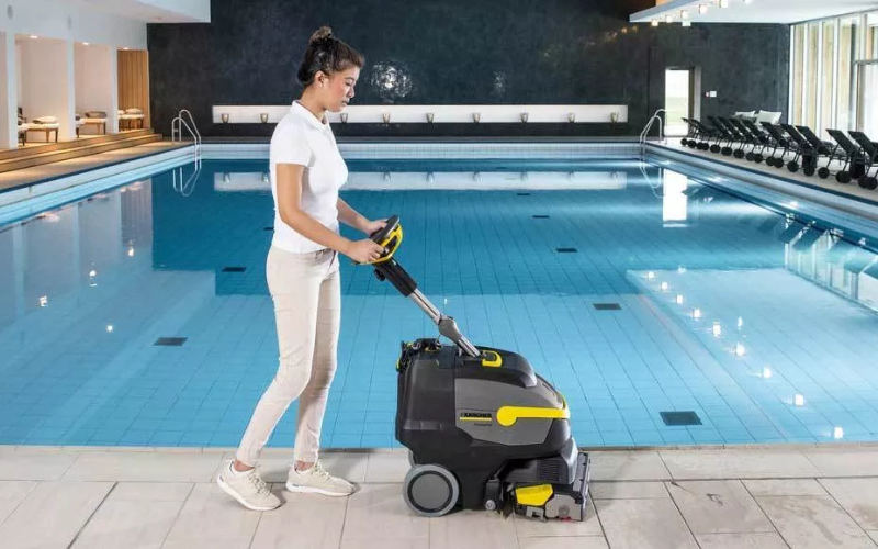 Compact Walk-Behind Floor Scrubbers in use